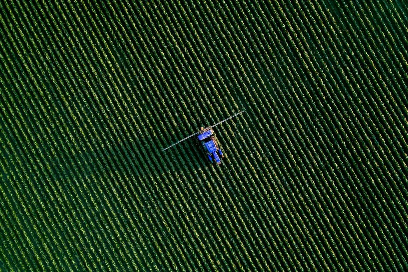 Crop spraying equipment applying formulated product across a field