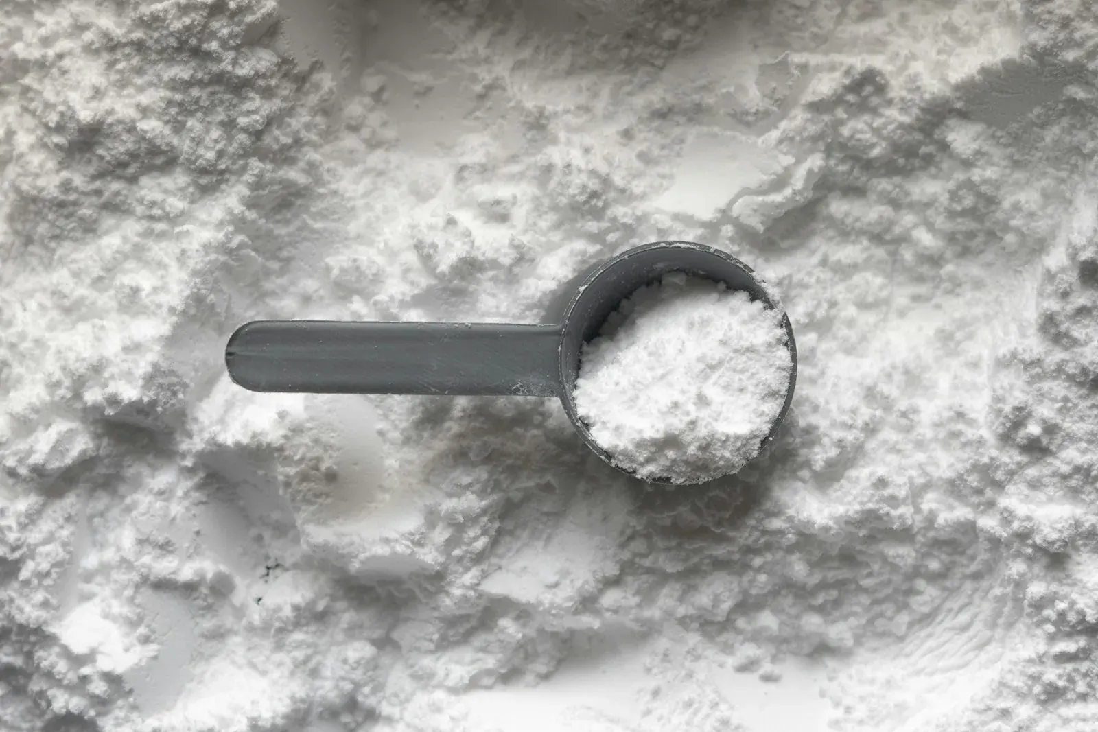 Palladium on carbon catalyst being weighed for a hydrogenation reaction