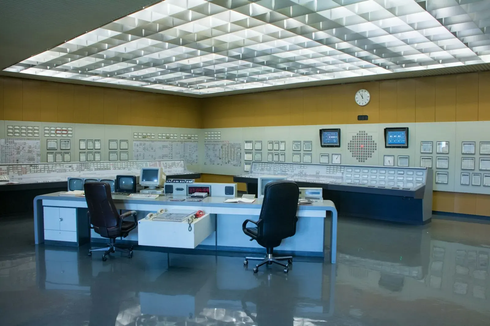 Analyst reviewing in-line spectroscopic process data at a control station
